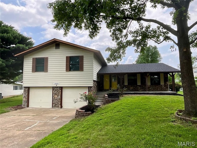 3919 Bellvue Dr, Saint Peters, MO 63376 - split level home featuring stone siding, a garage, concrete driveway, and a front yard