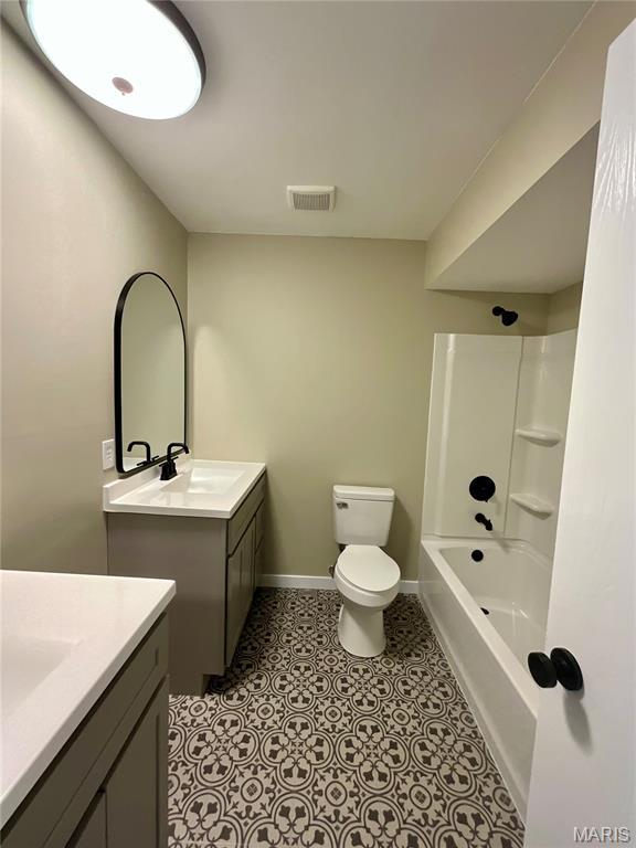 3919 Bellvue Dr, Saint Peters, MO 63376 - bathroom featuring two vanities and shower / washtub combination