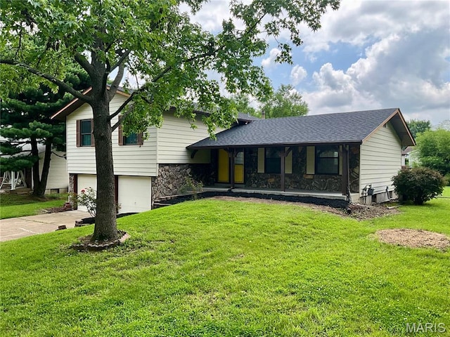 3919 Bellvue Dr, Saint Peters, MO 63376 - tri-level home with covered porch, a garage, stone siding, a front yard, and concrete driveway