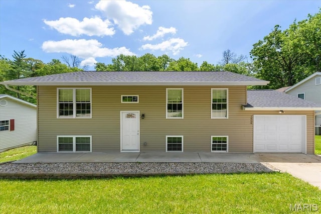 1954 Waybridge Ln, Fenton, MO 63026 - split foyer home featuring a front yard, an attached garage, driveway, and roof with shingles