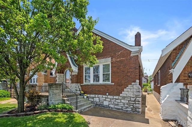 6314 Chippewa St, Saint Louis, MO 63109 - view of front of property featuring brick siding and a chimney
