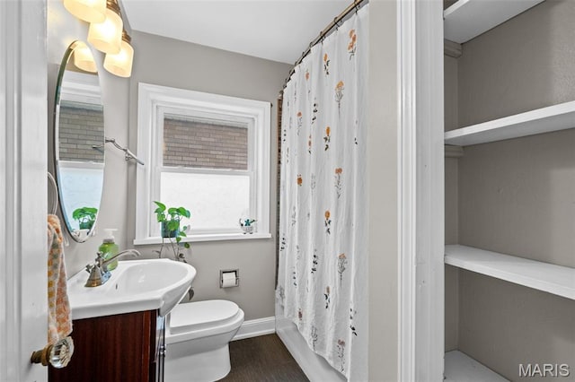 6314 Chippewa St, Saint Louis, MO 63109 - full bathroom featuring toilet, vanity, baseboards, and curtained shower