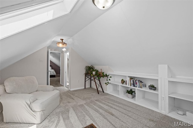 6314 Chippewa St, Saint Louis, MO 63109 - living area with carpet flooring, vaulted ceiling, and a skylight