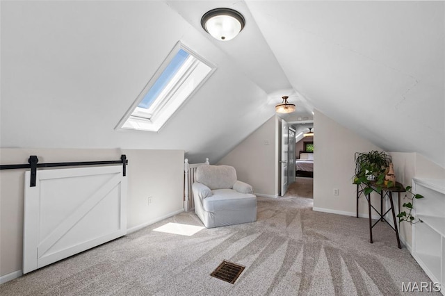 6314 Chippewa St, Saint Louis, MO 63109 - sitting room featuring carpet flooring, vaulted ceiling, baseboards, and a skylight