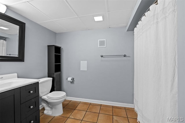 6314 Chippewa St, Saint Louis, MO 63109 - bathroom with toilet, vanity, tile patterned flooring, baseboards, and a drop ceiling