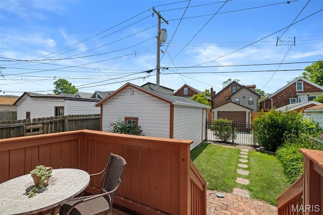 6314 Chippewa St, Saint Louis, MO 63109 - wooden deck with outdoor dining space, an outdoor structure, and a residential view