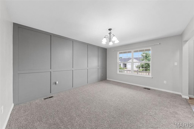 3169 Willow Point Dr, Imperial, MO 63052 - spare room with a chandelier and carpet