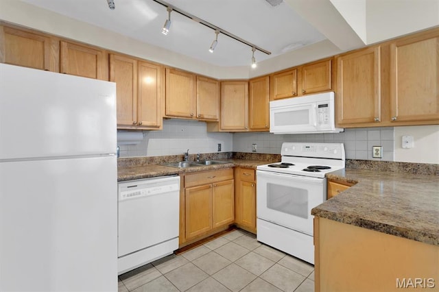 6026 Waterman Ave Unit 3E, Saint Louis, MO 63112 - kitchen featuring white appliances, a sink, decorative backsplash, light tile patterned floors, and dark countertops
