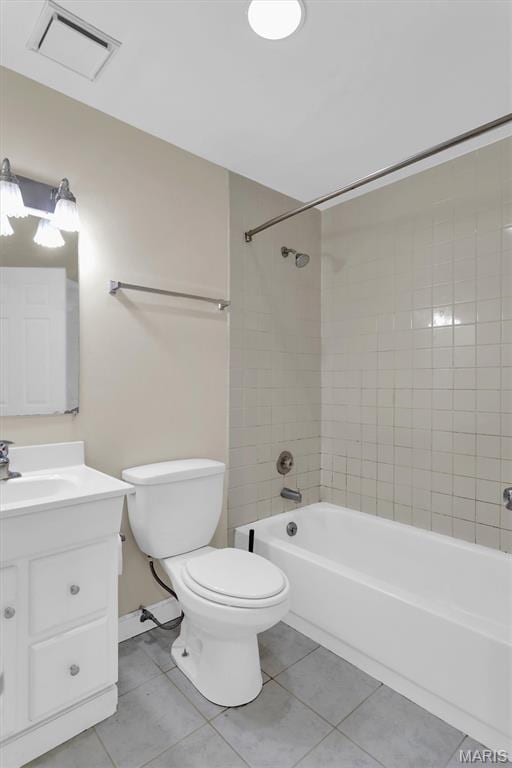 6026 Waterman Ave Unit 3E, Saint Louis, MO 63112 - full bathroom with tile patterned floors, toilet, vanity, bathing tub / shower combination, and baseboards