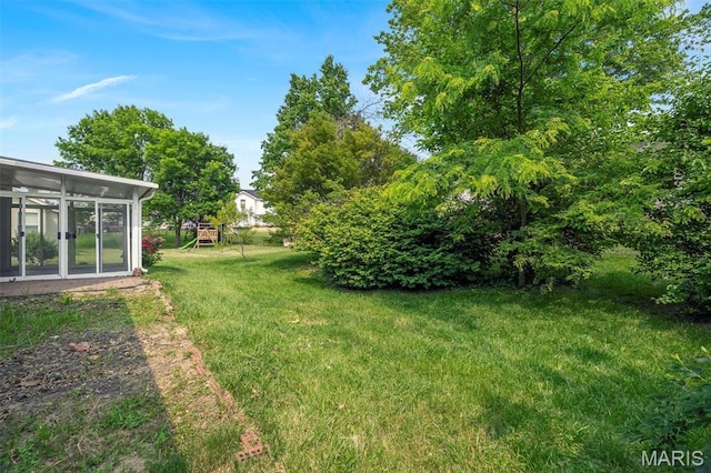 1045 Sprinters Row Dr, Florissant, MO 63034 - view of green lawn featuring a sunroom