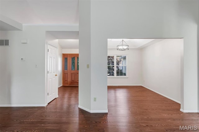 1045 Sprinters Row Dr, Florissant, MO 63034 - unfurnished dining area with wood finished floors, a chandelier, and baseboards