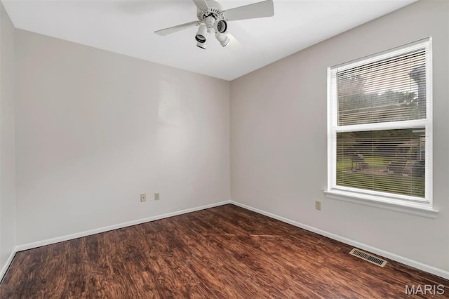 1045 Sprinters Row Dr, Florissant, MO 63034 - spare room featuring wood finished floors, baseboards, and ceiling fan