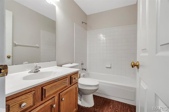 1045 Sprinters Row Dr, Florissant, MO 63034 - bathroom featuring vanity, toilet, wood finished floors, and shower / washtub combination