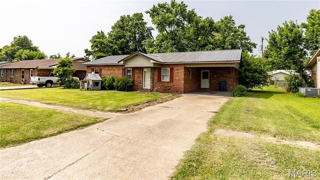 141 Saint Catherine Ln, New Madrid, MO 63869 - single story home with brick siding, concrete driveway, a front yard, a carport, and cooling unit