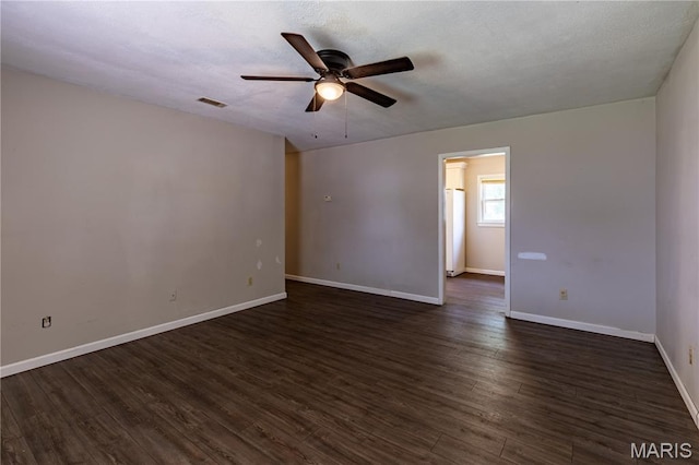 141 Saint Catherine Ln, New Madrid, MO 63869 - spare room with a ceiling fan, dark wood-style floors, and baseboards