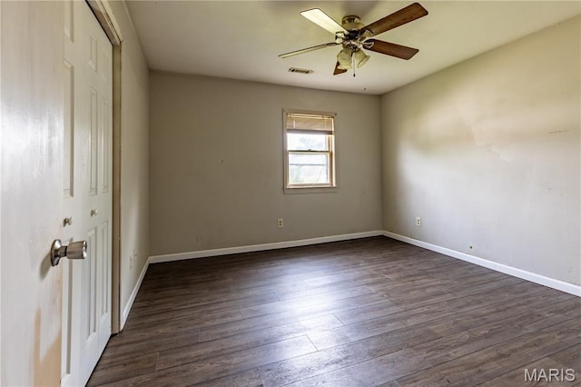 141 Saint Catherine Ln, New Madrid, MO 63869 - unfurnished room with ceiling fan, dark wood finished floors, and baseboards