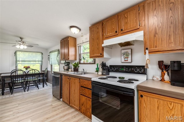 28079 Sapphire, Richland, MO 65556 - kitchen with electric range oven, under cabinet range hood, dishwasher, a sink, and brown cabinetry