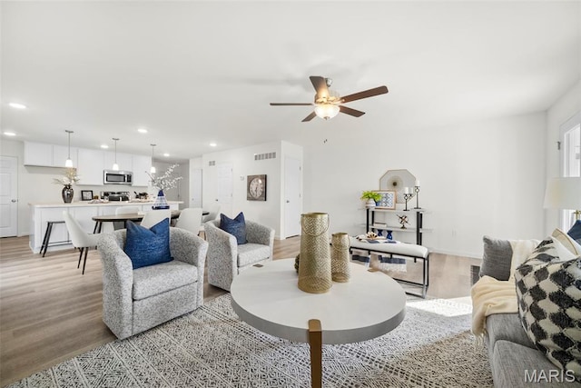3064 Pirogue St, Saint Charles, MO 63301 - living area with light wood-style flooring, recessed lighting, and a ceiling fan