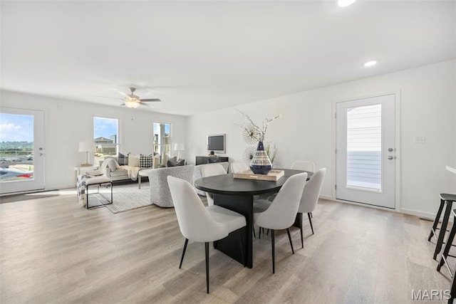 3064 Pirogue St, Saint Charles, MO 63301 - dining space with light wood-style floors, a ceiling fan, recessed lighting, and baseboards
