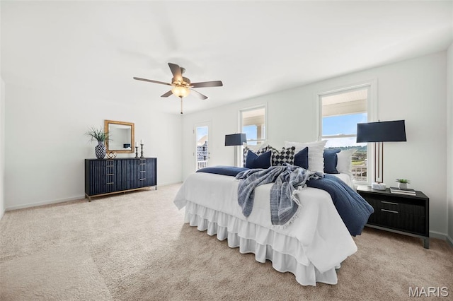 3064 Pirogue St, Saint Charles, MO 63301 - carpeted bedroom with multiple windows, ceiling fan, and baseboards