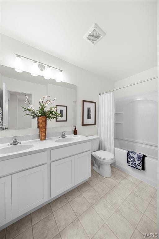 3064 Pirogue St, Saint Charles, MO 63301 - full bathroom with double vanity, tile patterned flooring, shower / bath combo with shower curtain, and toilet