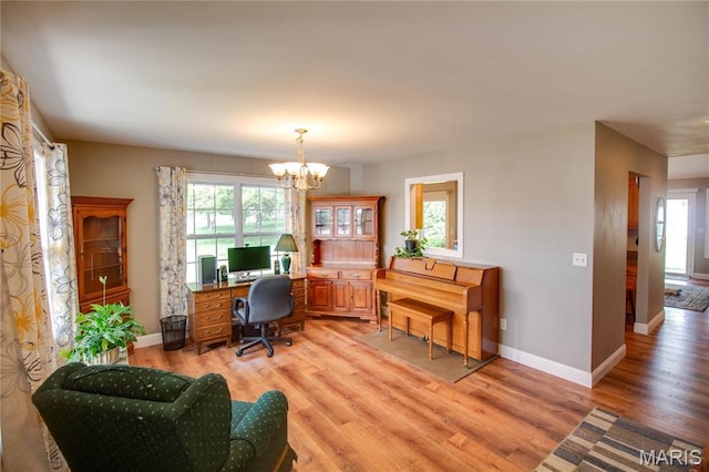2 Breezeway Ct, Jerseyville, IL 62052 - office space featuring a chandelier, light wood-style floors, and baseboards