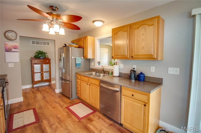 2 Breezeway Ct, Jerseyville, IL 62052 - kitchen featuring appliances with stainless steel finishes, a sink, ceiling fan, light wood-type flooring, and light brown cabinets
