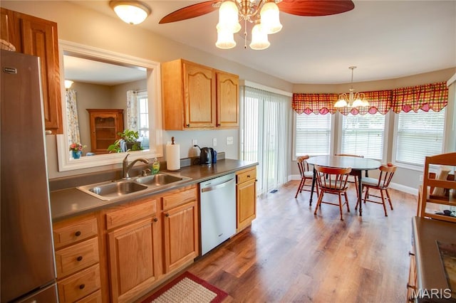2 Breezeway Ct, Jerseyville, IL 62052 - kitchen featuring stainless steel appliances, a sink, a chandelier, wood finished floors, and ceiling fan