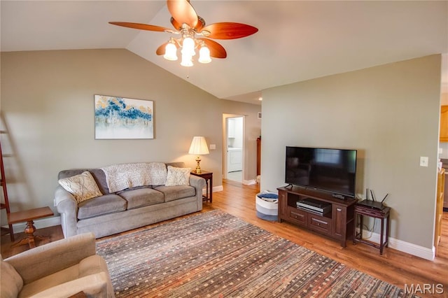 2 Breezeway Ct, Jerseyville, IL 62052 - living room featuring a ceiling fan, washer / clothes dryer, light wood-style flooring, vaulted ceiling, and baseboards