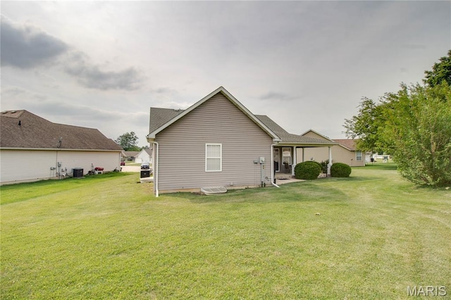 2 Breezeway Ct, Jerseyville, IL 62052 - back of house featuring central air condition unit and a lawn