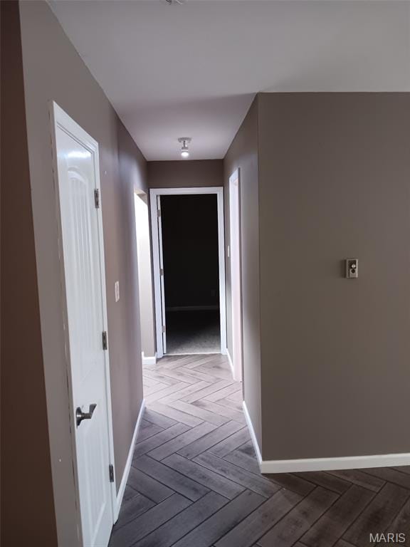 7731 Hazelcrest Dr Unit B, Hazelwood, MO 63042 - hallway featuring baseboards