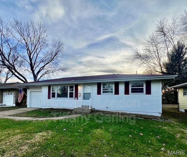 170 Ruth Dr, Florissant, MO 63031 - view of front of home with an attached garage, a front lawn, and concrete driveway
