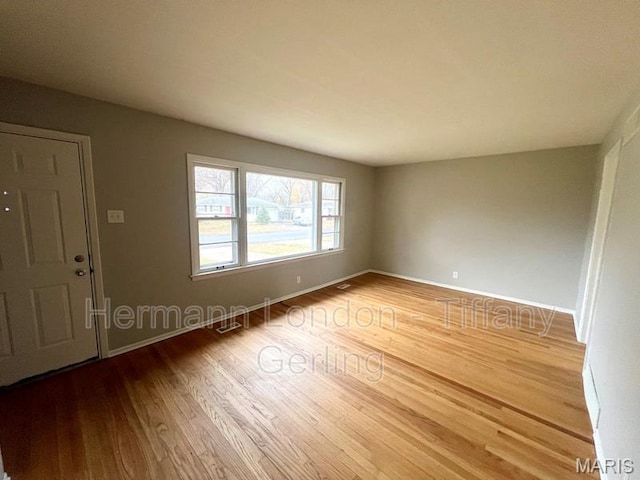 170 Ruth Dr, Florissant, MO 63031 - spare room with wood finished floors and baseboards