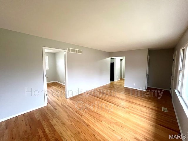 170 Ruth Dr, Florissant, MO 63031 - empty room with wood finished floors and baseboards