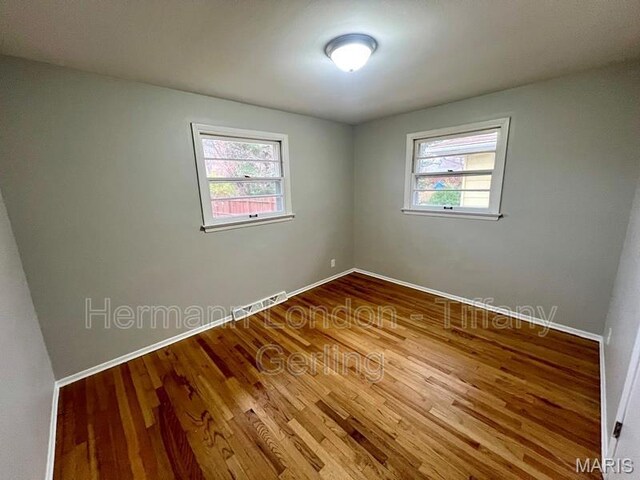 170 Ruth Dr, Florissant, MO 63031 - unfurnished room with plenty of natural light, wood finished floors, and baseboards