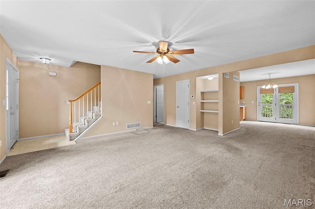 4505 Sherman Park Dr, Saint Charles, MO 63303 - unfurnished living room featuring a chandelier, carpet flooring, ceiling fan, and stairway