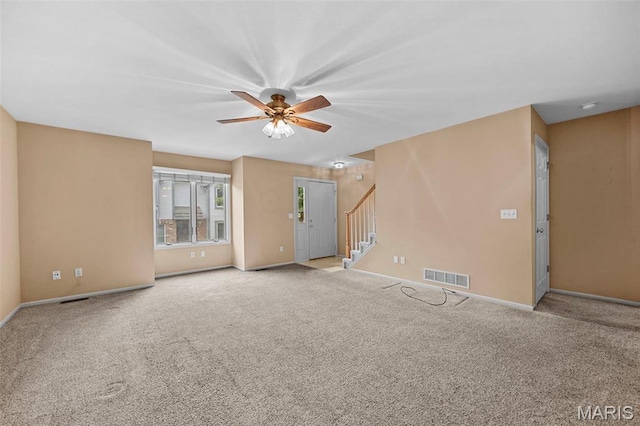 4505 Sherman Park Dr, Saint Charles, MO 63303 - carpeted empty room with stairs, a ceiling fan, and baseboards