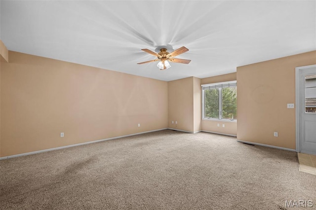 4505 Sherman Park Dr, Saint Charles, MO 63303 - carpeted empty room with a ceiling fan and baseboards