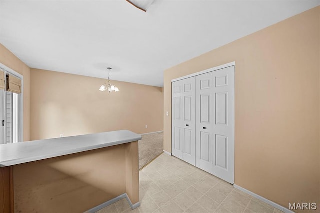 4505 Sherman Park Dr, Saint Charles, MO 63303 - kitchen with baseboards, a chandelier, decorative light fixtures, and light floors