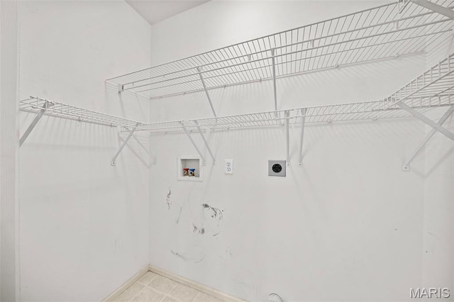4505 Sherman Park Dr, Saint Charles, MO 63303 - laundry room featuring hookup for an electric dryer, washer hookup, baseboards, and light tile patterned floors