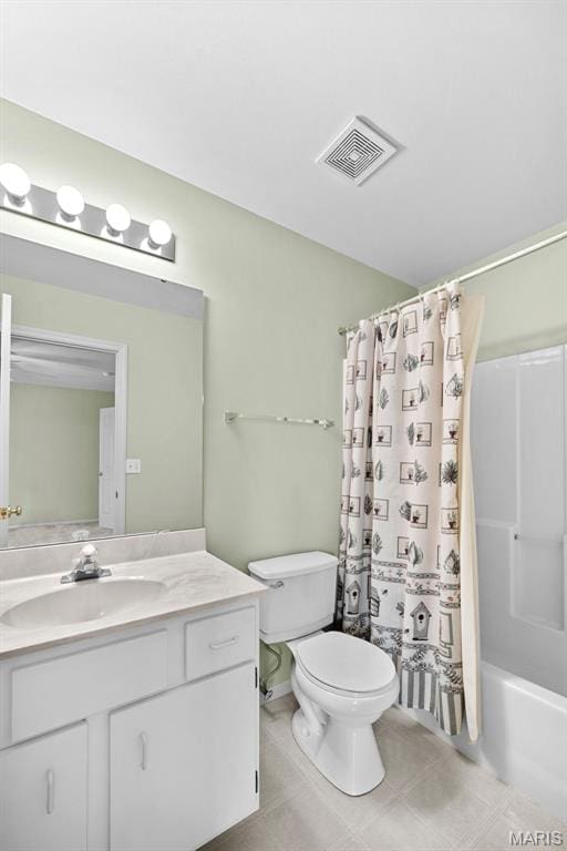 4505 Sherman Park Dr, Saint Charles, MO 63303 - bathroom with toilet, vanity, shower / tub combo with curtain, and tile patterned floors