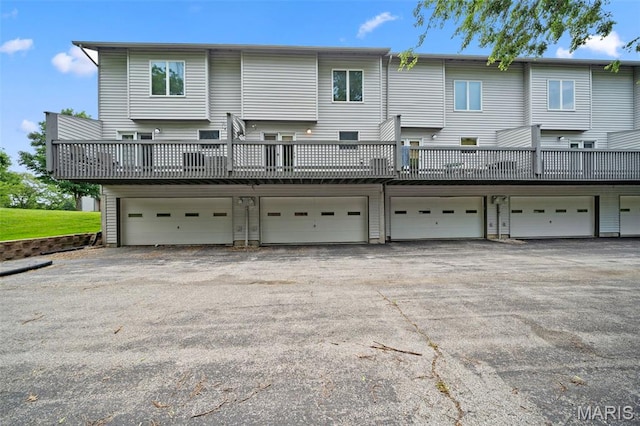 4505 Sherman Park Dr, Saint Charles, MO 63303 - back of property featuring a garage and a deck