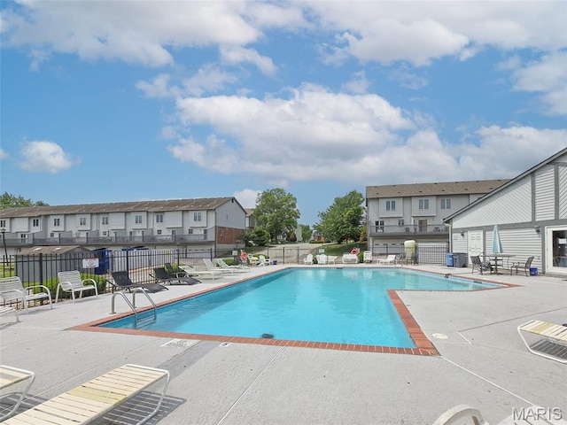 4505 Sherman Park Dr, Saint Charles, MO 63303 - community pool with a patio and a residential view