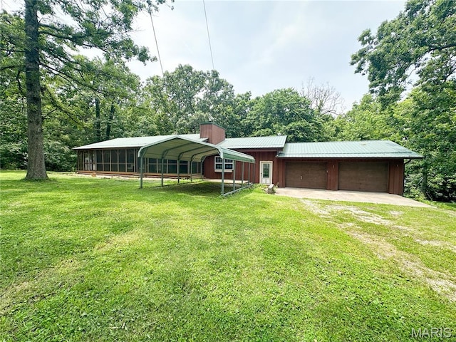 1 Timber Ln, Salem, MO 65560 - view of front of house with a front yard, driveway, a chimney, board and batten siding, and a carport