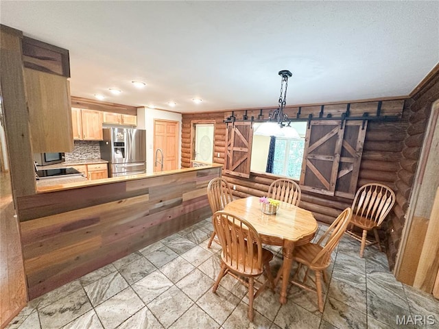 1 Timber Ln, Salem, MO 65560 - dining room featuring log walls, a barn door, and recessed lighting