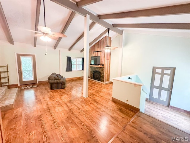 1 Timber Ln, Salem, MO 65560 - unfurnished living room with a ceiling fan, a fireplace with raised hearth, light wood-type flooring, and baseboards
