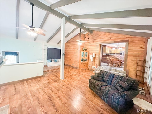 1 Timber Ln, Salem, MO 65560 - living area featuring wood walls, a ceiling fan, wood finished floors, baseboards, and a chandelier
