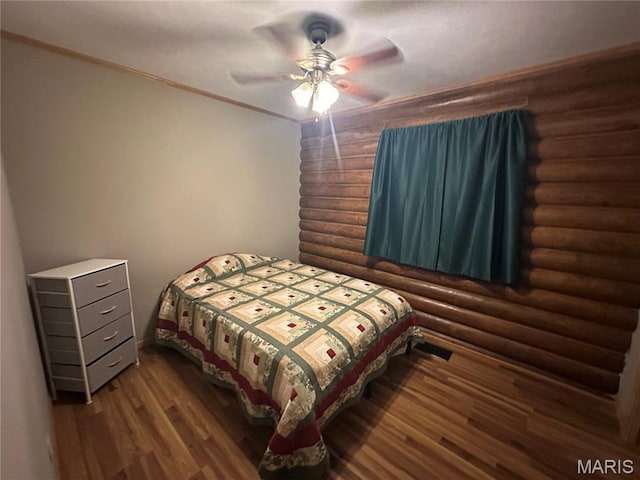 1 Timber Ln, Salem, MO 65560 - bedroom with rustic walls, wood finished floors, and ceiling fan
