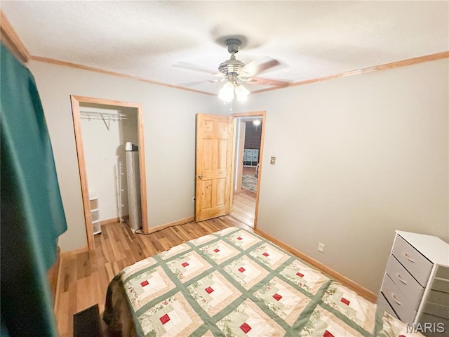 1 Timber Ln, Salem, MO 65560 - bedroom featuring light wood-style flooring, baseboards, a ceiling fan, a closet, and crown molding
