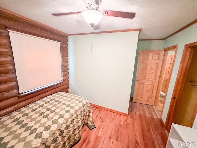 1 Timber Ln, Salem, MO 65560 - bedroom with light wood-style floors, crown molding, rustic walls, baseboards, and ceiling fan